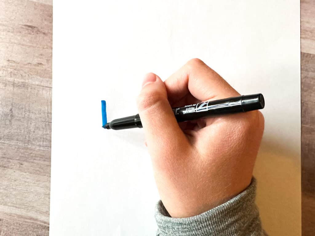 hand showing correct way to hold brush pen