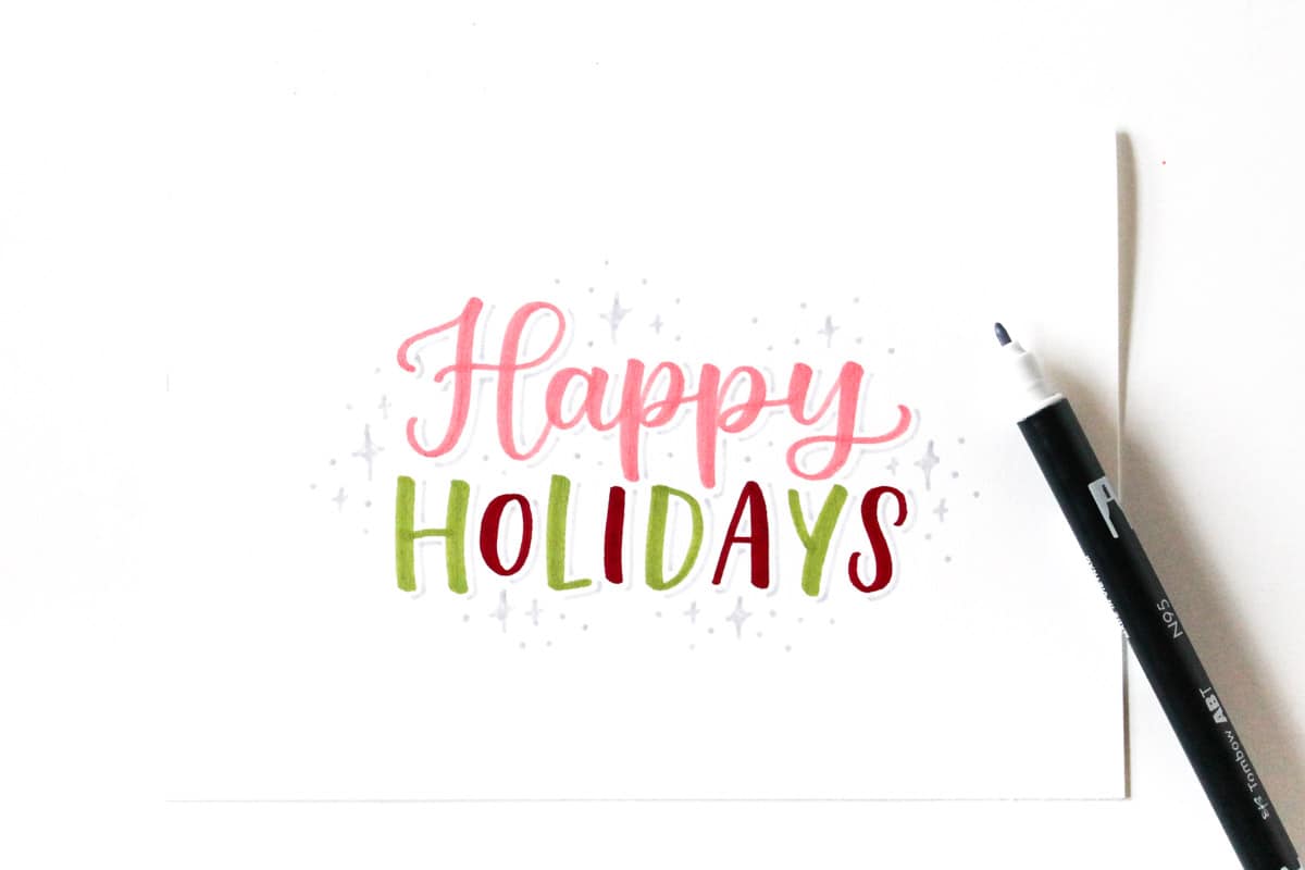 Decorating holiday greeting card with stars